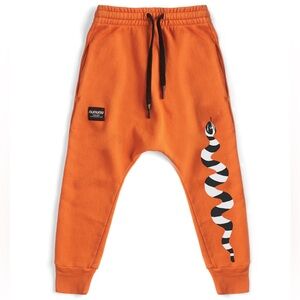 Nununu stripey snake baggy pants in orange